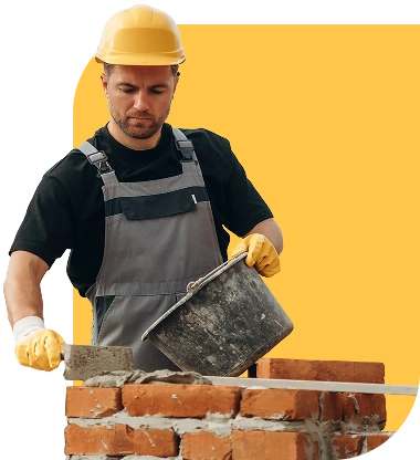 Albañil trabajando en la construcción de una casa Albañil trabajando en la construcción de una casa